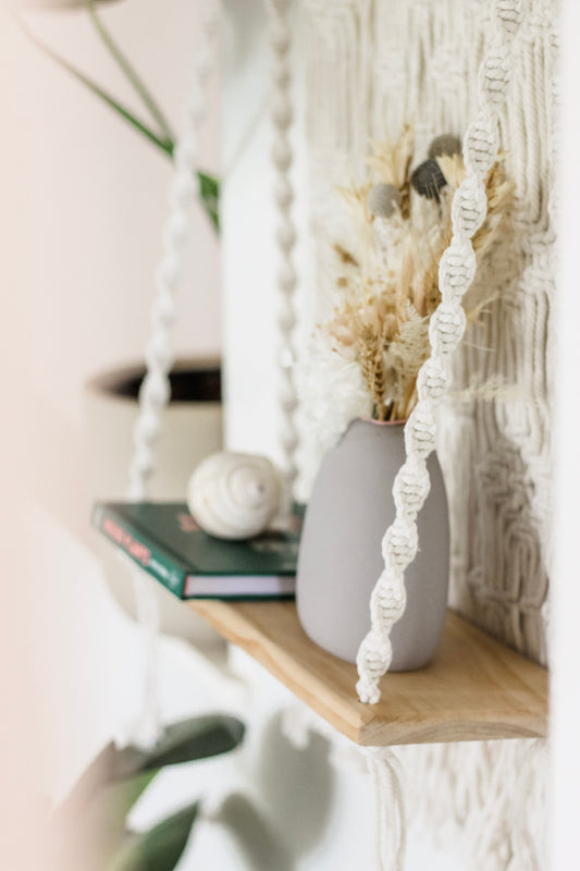 macrame wall hanging with shelf