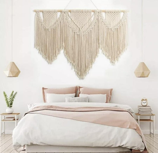 florence macrame wall hanging above a boho bed